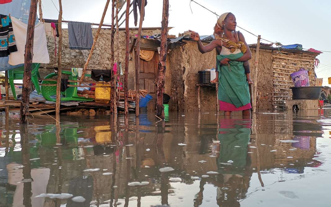  Flood survivor wading in water in Beira 