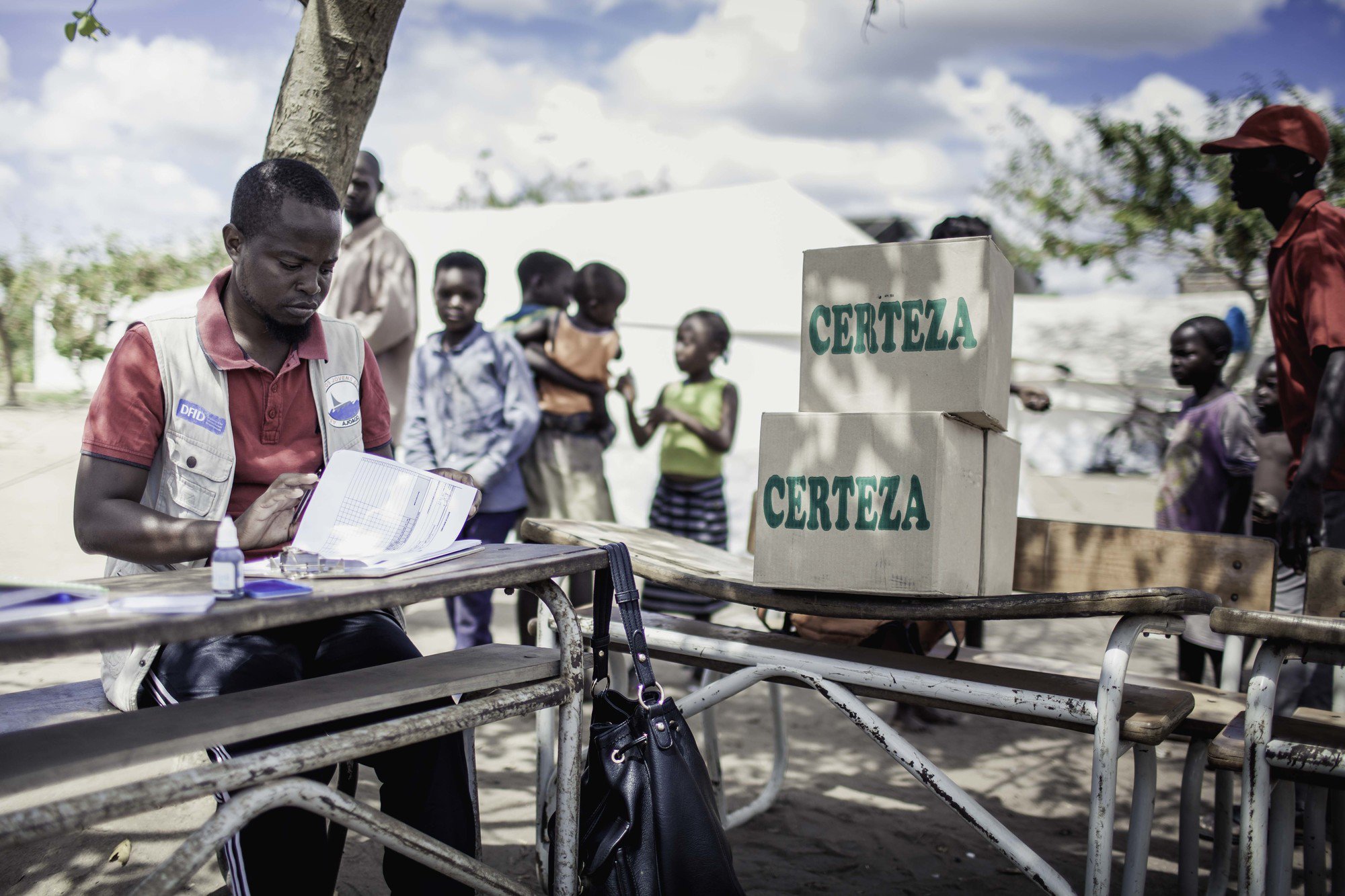  Nelson Memba distributes water purification chemicals in Guaru-Guaru, Mozambique after Cyclone Idai 