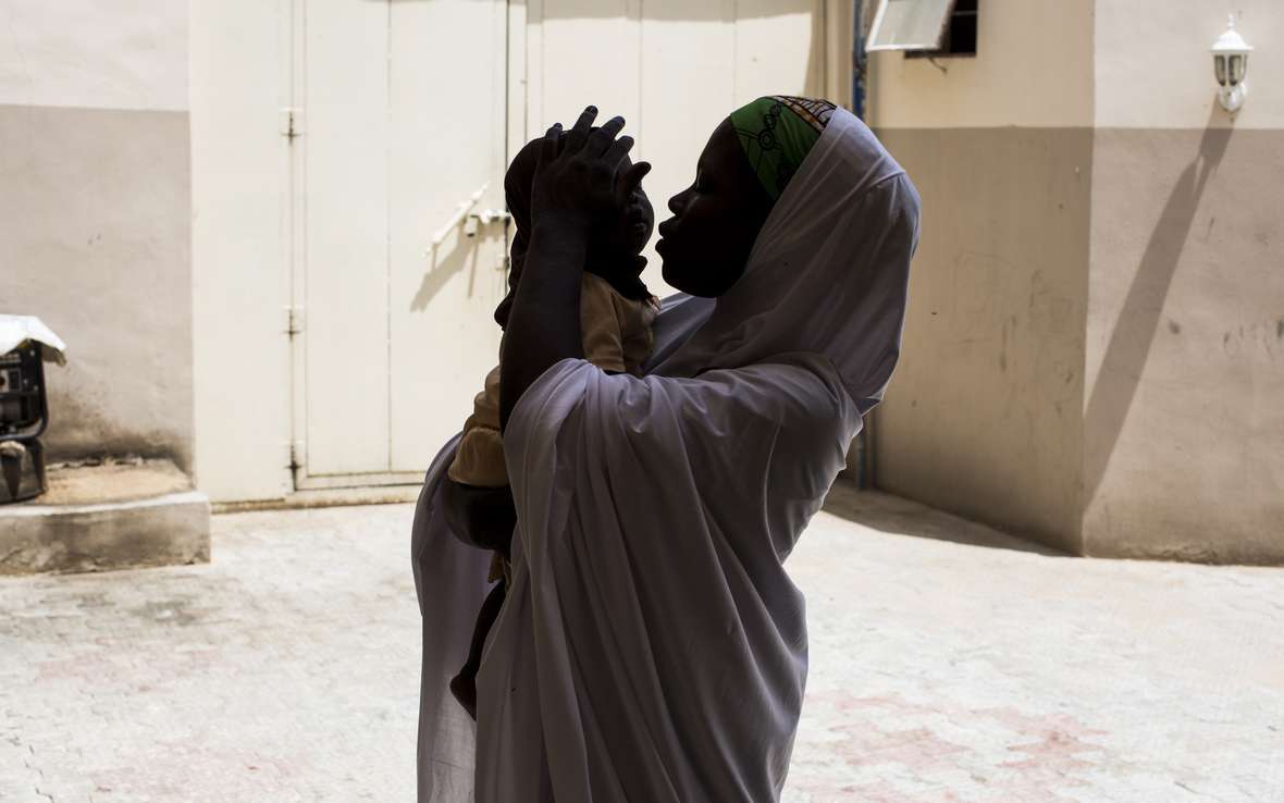 BETTER_Kadija_holding_daughter_101794lpr.jpg