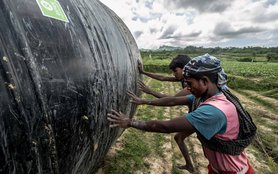 bangladesh-men-water-tank-field-ogb-109675-h.jpg