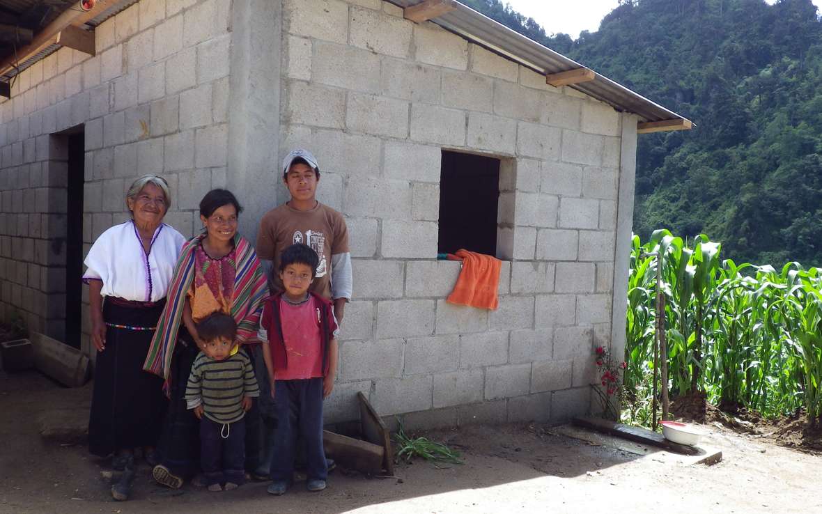 family-in-front-of-home-guatemala-7-3-13