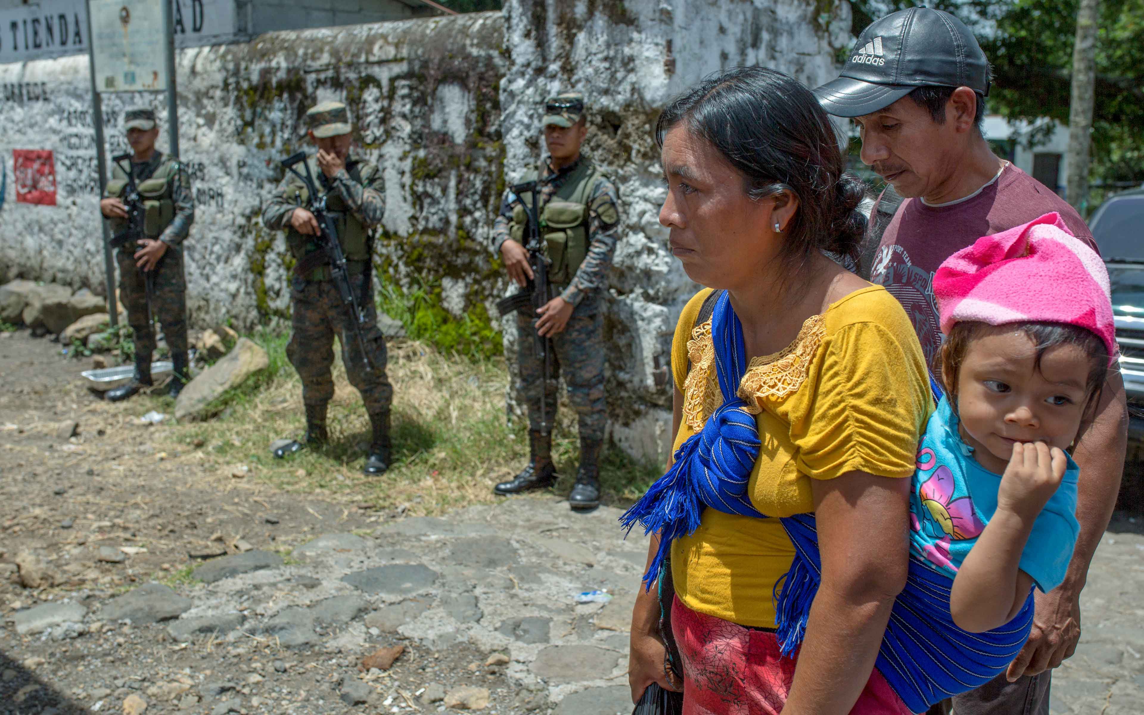 Many years after Guatemala’s internal conflict, the same army that persecuted the ethnic Maya people in the western highlands is now carrying out a humanitarian mission to assist them in the evacuation of their new home in La Trinidad.