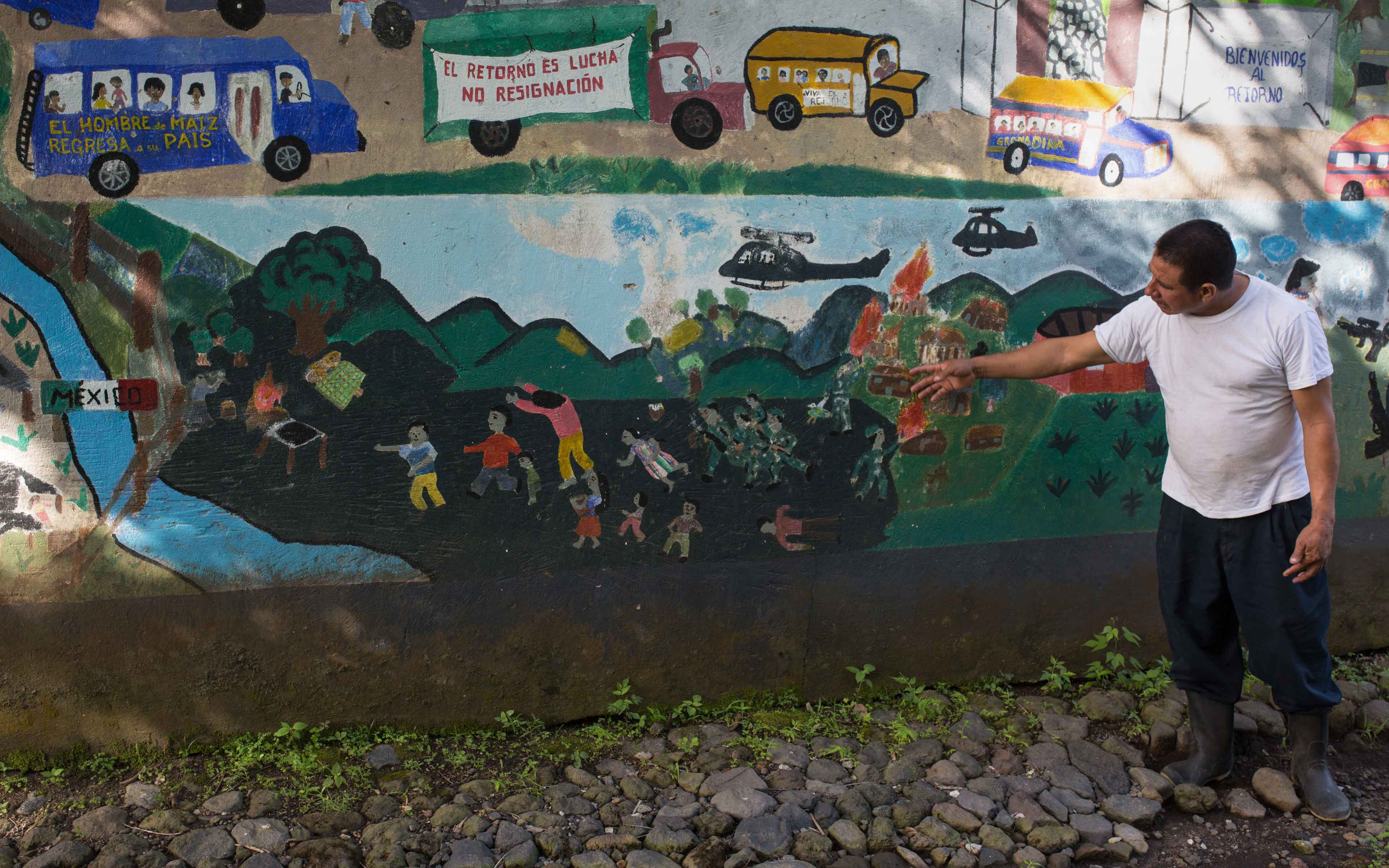Gilberto Camposeco walks explains the history of his community, now known as La Trinidad, and how they had to flee the army to Mexico during the war in 1982
