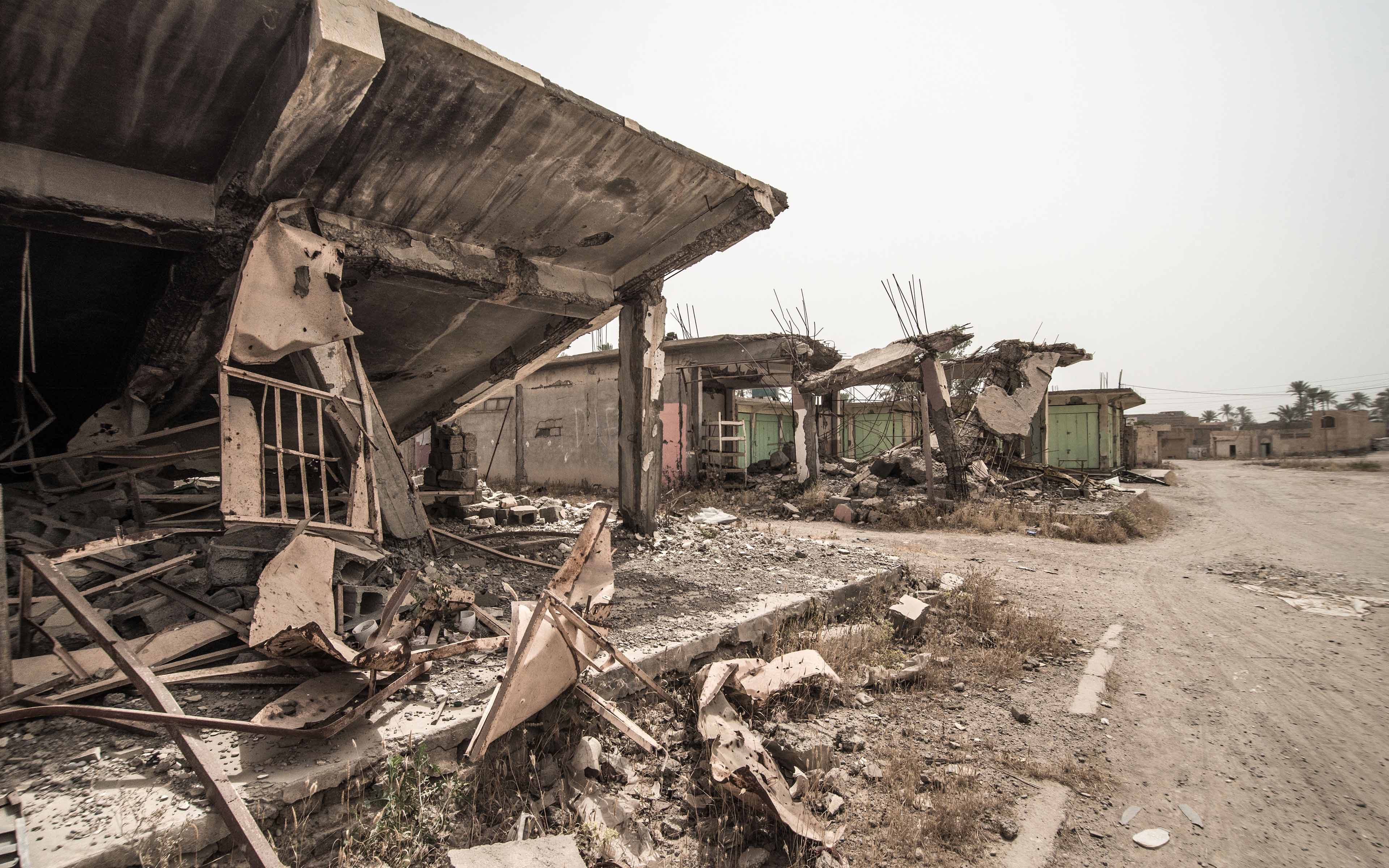 Destroyed buildings line the streets of Saadiya, an Iraqi town occupied by ISIS in 2014. Though the town has now been reclaimed, many families have yet to return to their homes. The mayor says one of the challenges families face is a lack of work. Without jobs, they don’t have the means to repair their homes.