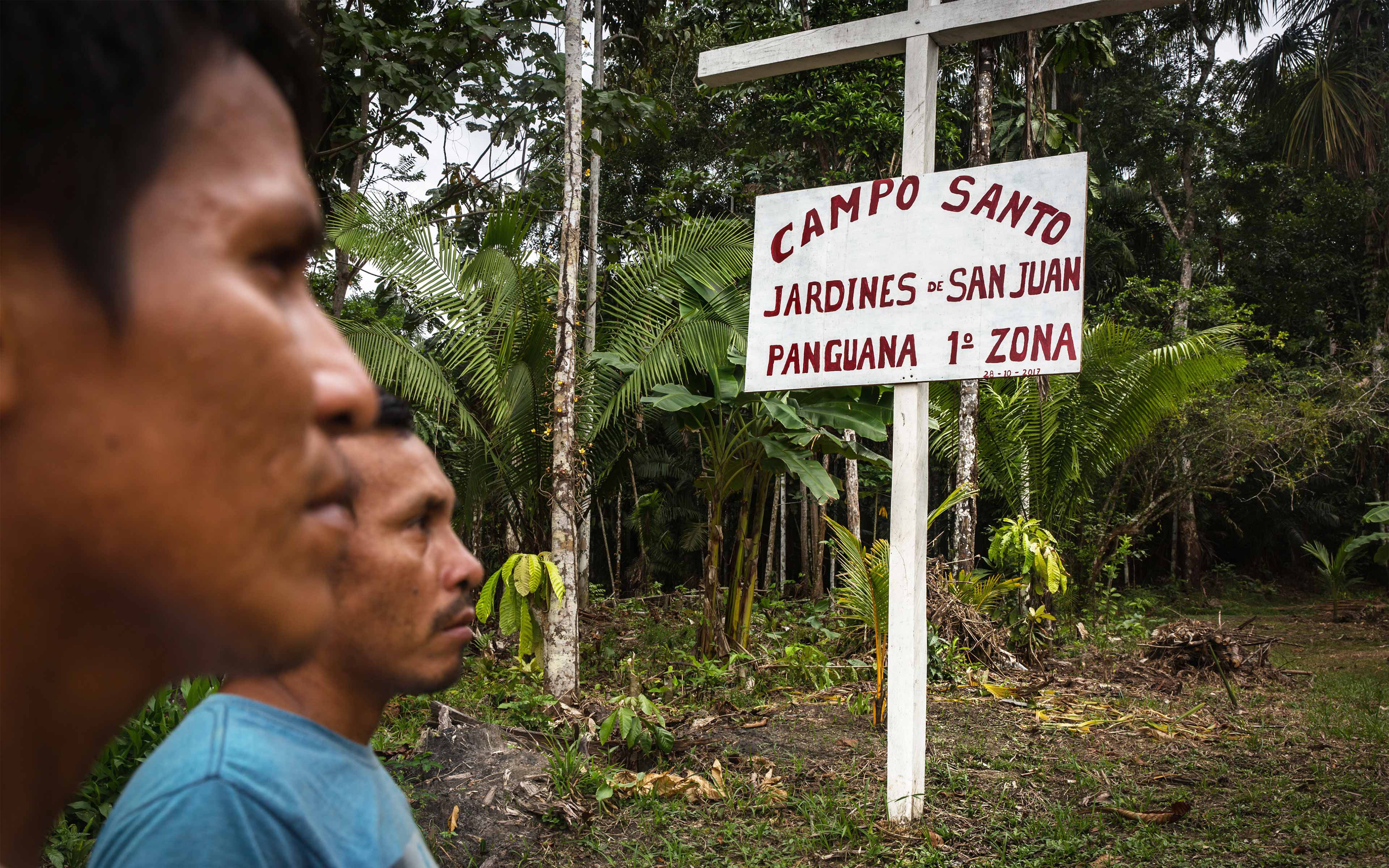 Men from Panguana stand at the entrance to the town’s cemetery, on land acquired by Cacao del Peru Norte. Villagers say the company is not asking them to move the cemetery, but it is proposing shifting the entrance to a less convenient location. The Peruvian Society for Environmental Law (SPDA), one of Oxfam’s partners in Peru, is helping the community negotiate with the company.