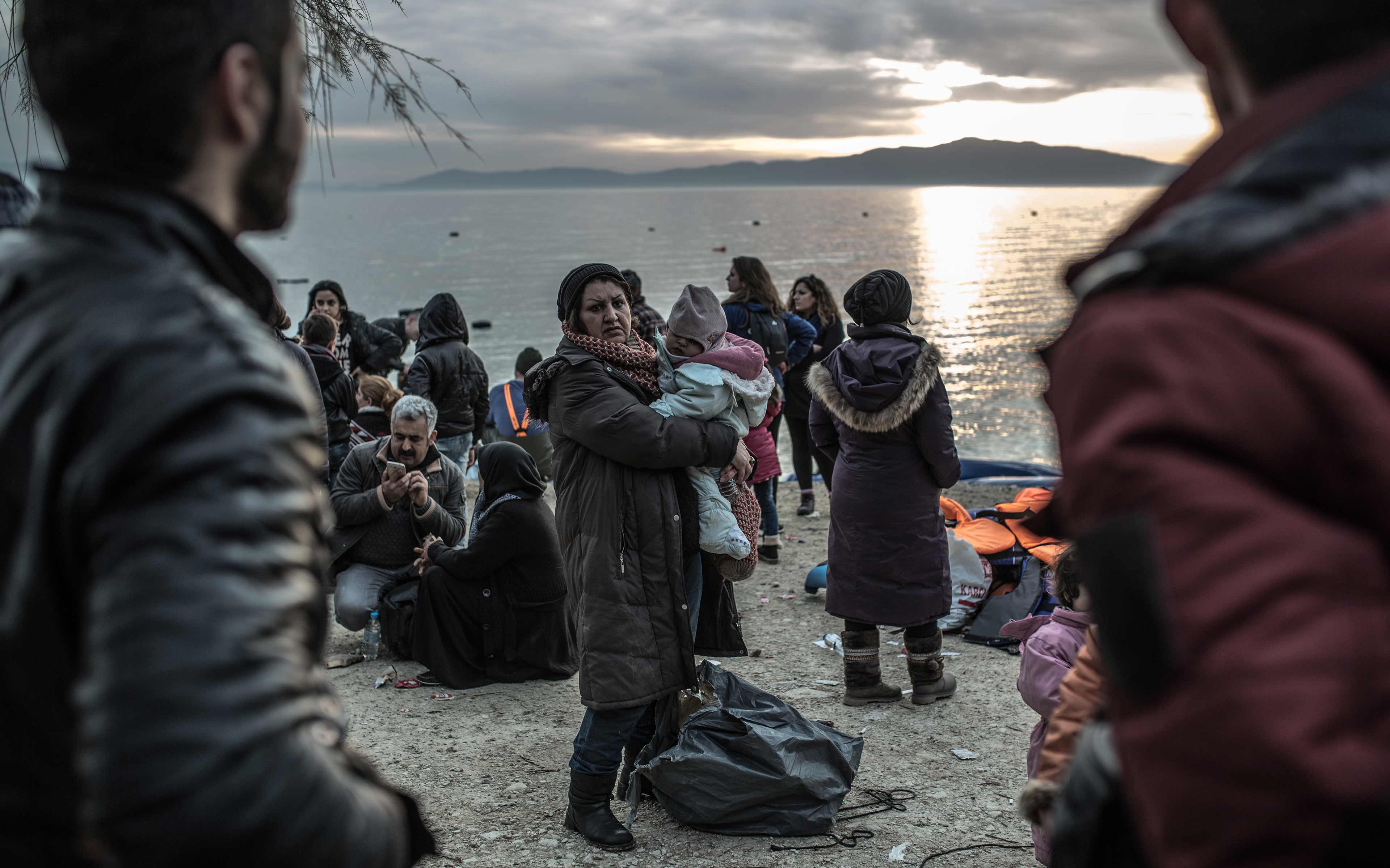 Safe on shore, refugees who made it to the Greek island of Lesbos in February 2016 plan for the next step of their long trek to safety. Already many have endured a harrowing journey, paying traffickers up to 1,000 Euros per person for the passage.