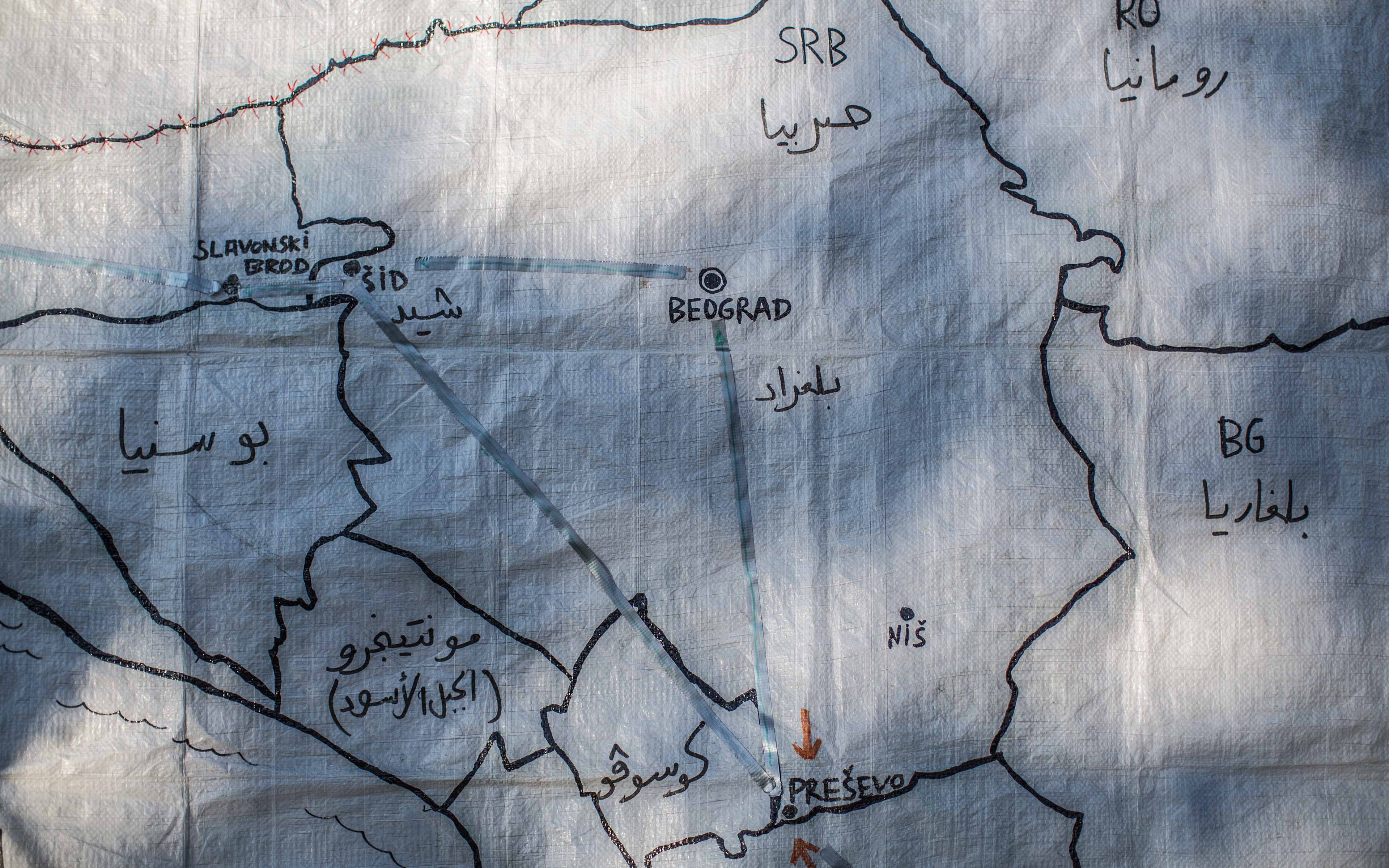 A map drawn on a piece of plastic sheeting marks key points in Serbia— Presevo and Sid-- for refugees making their way toward safety. “There is a
common feeling in Zaatari, in Lebanon, in Turkey, or in the Balkans route
and it is that there is no Syria where they (refugees) can go back to,” says
photographer Pablo Tosco.