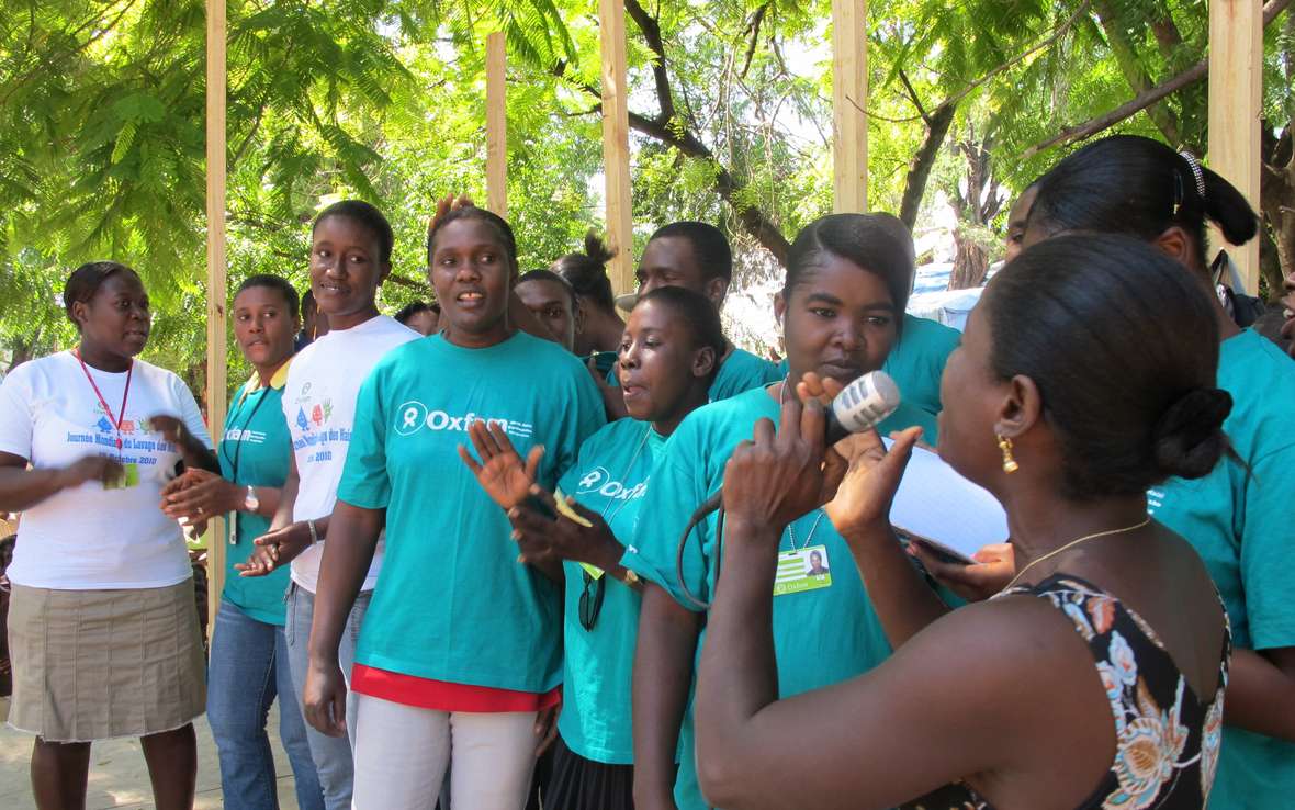 woman-with-microphone-and-crowd-in-ox-t-shirts.jpg